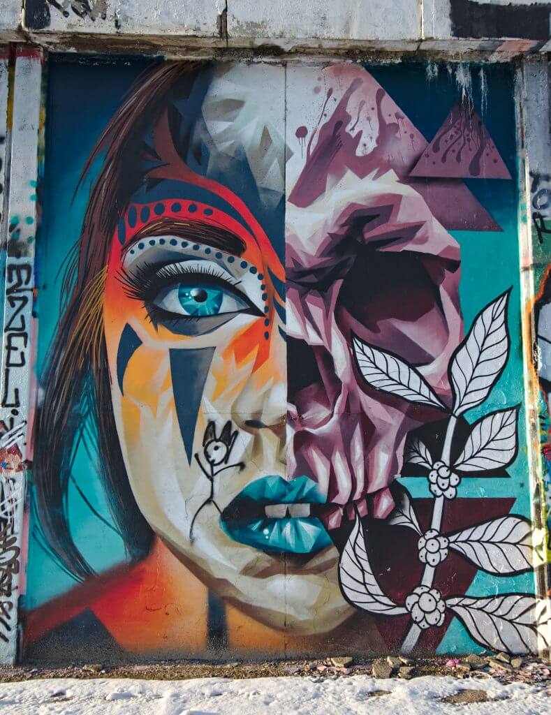 double face street art