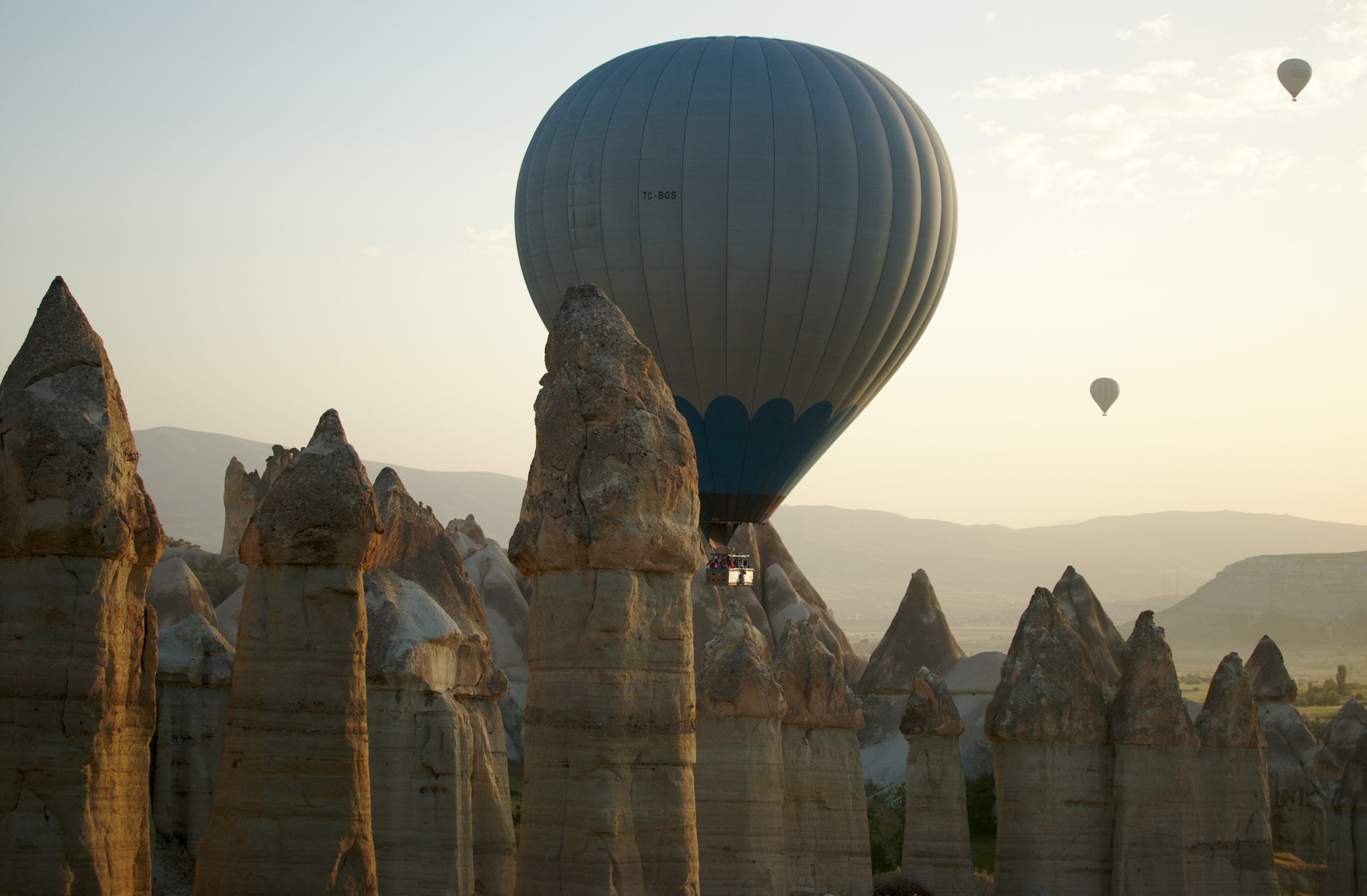 hot air balloons in valleys