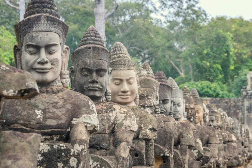 carved heads at the edge of Angkor Thom temple