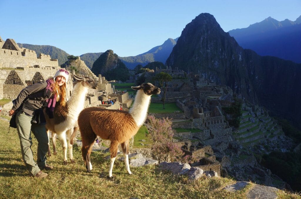 Fabienne and two llamas in front of Machu Picchu