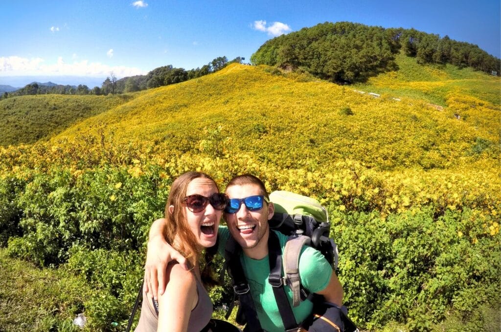 Fabienne and Benoit in front of the sunflower field at Doi Mae U Kho