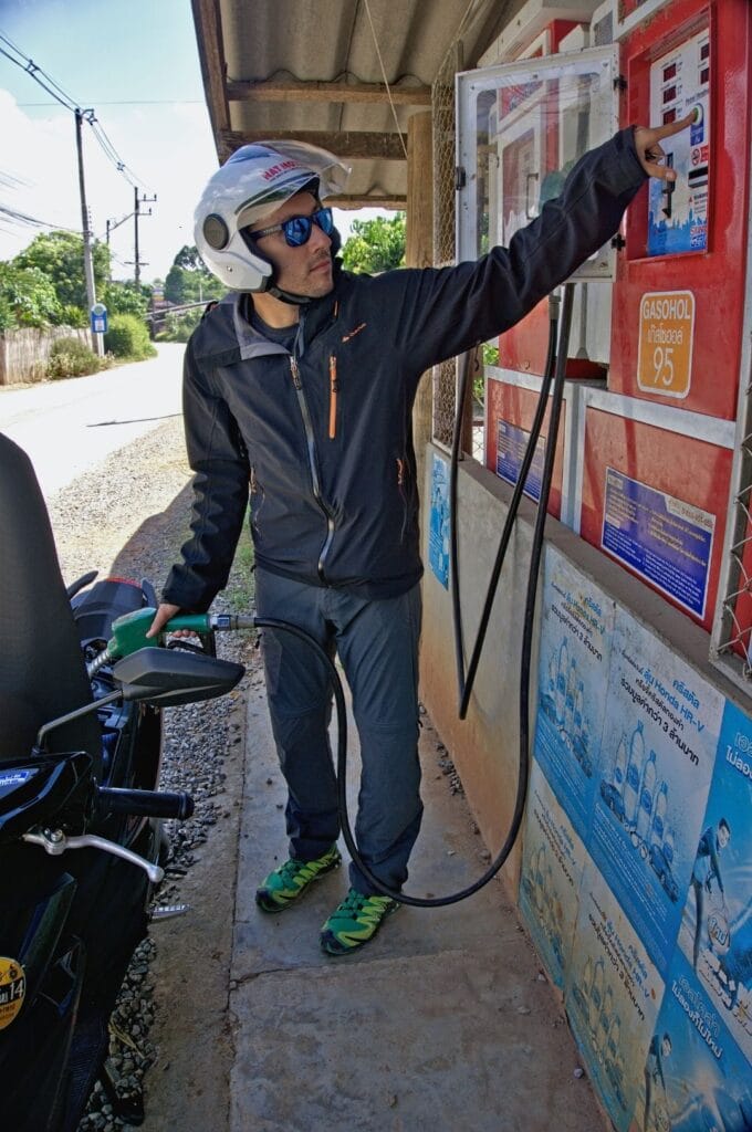Benoit filling up the scooter with fuel