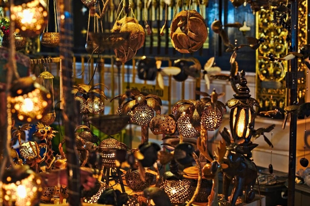 wood and metal decorations on a stall in a Chiang Mai market