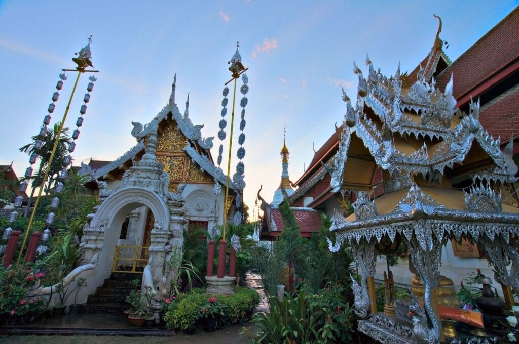 Temple enclosure in Chiang Mai with gilded and metallic architectural details